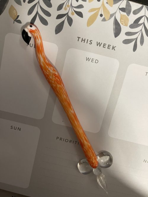 Glass pen in the shape of an orange flamingo